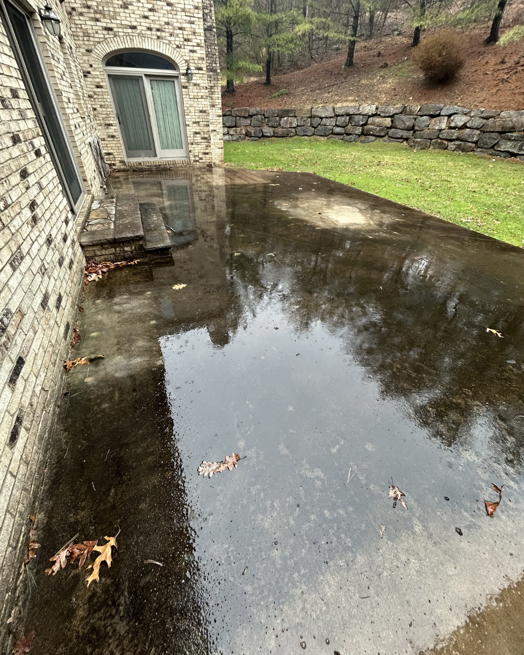 Dirty patio before pressure washing, paver restoration near me