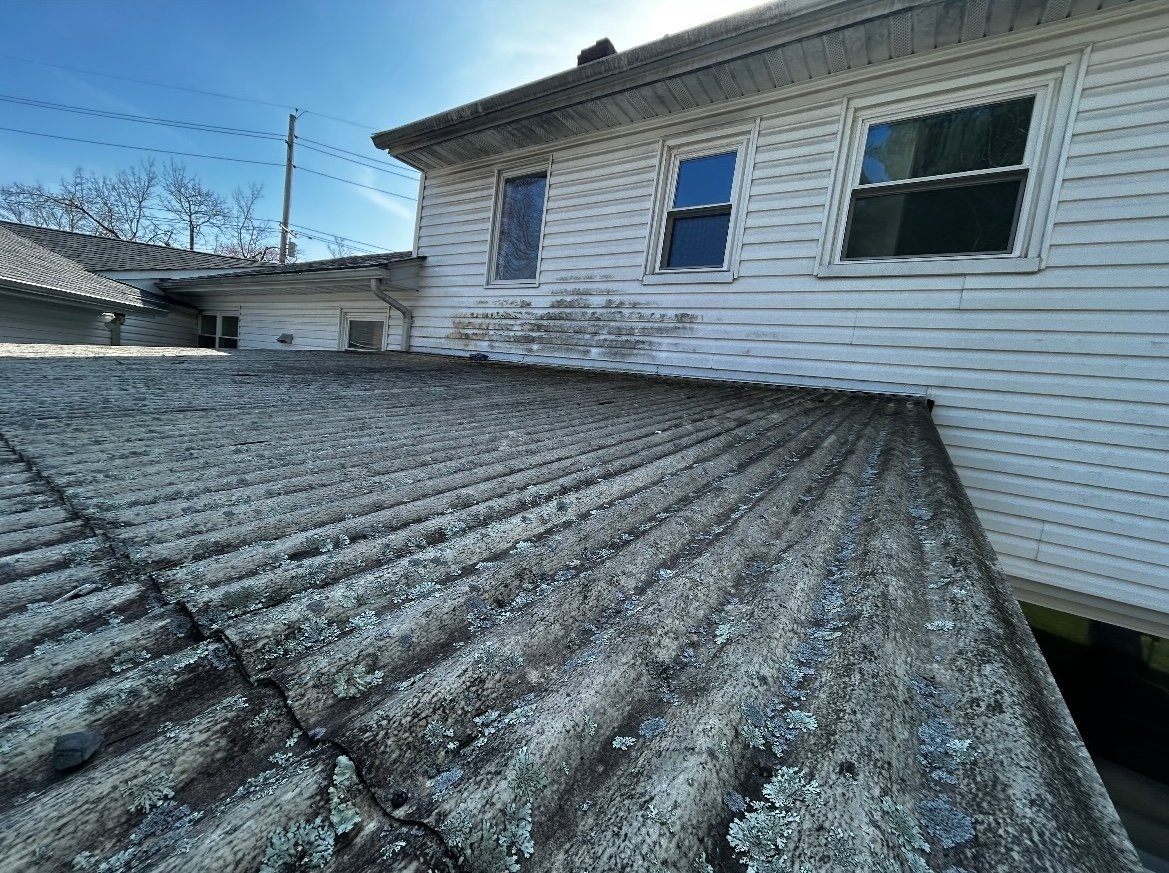Streaked mossy roof before roof washing in North Jersey